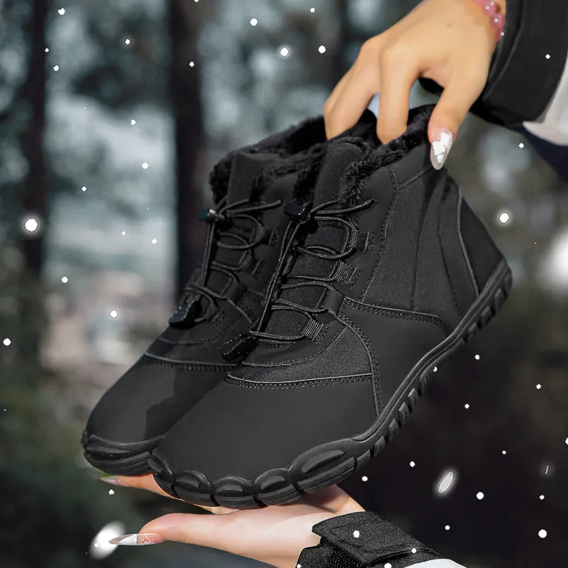 Unisex black waterproof snow boots with lace-up front and thick rubber sole on a snowy background.
