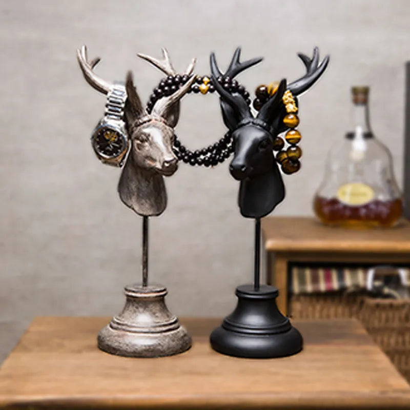 Tall black natural resin animal sculpture for home decoration on a wooden table.