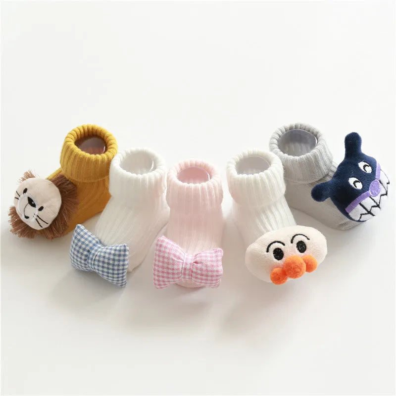 Cotton baby floor socks in various patterns including animal prints, stars, and bows for infants aged 0-3 months