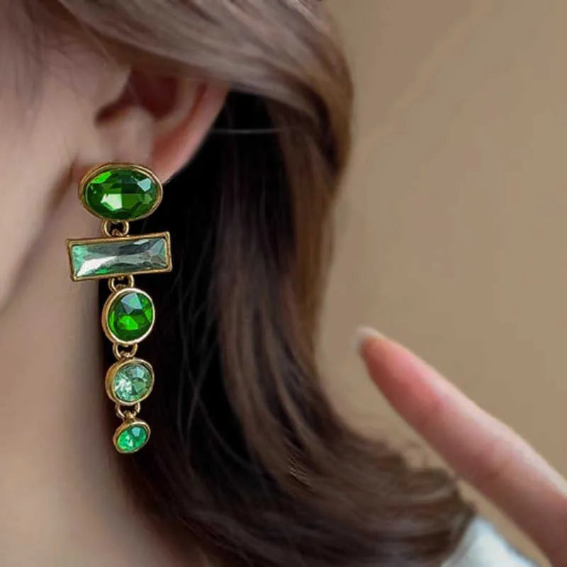 A pair of green gradient geometric alloy earrings with zircon inlay and tassel details.