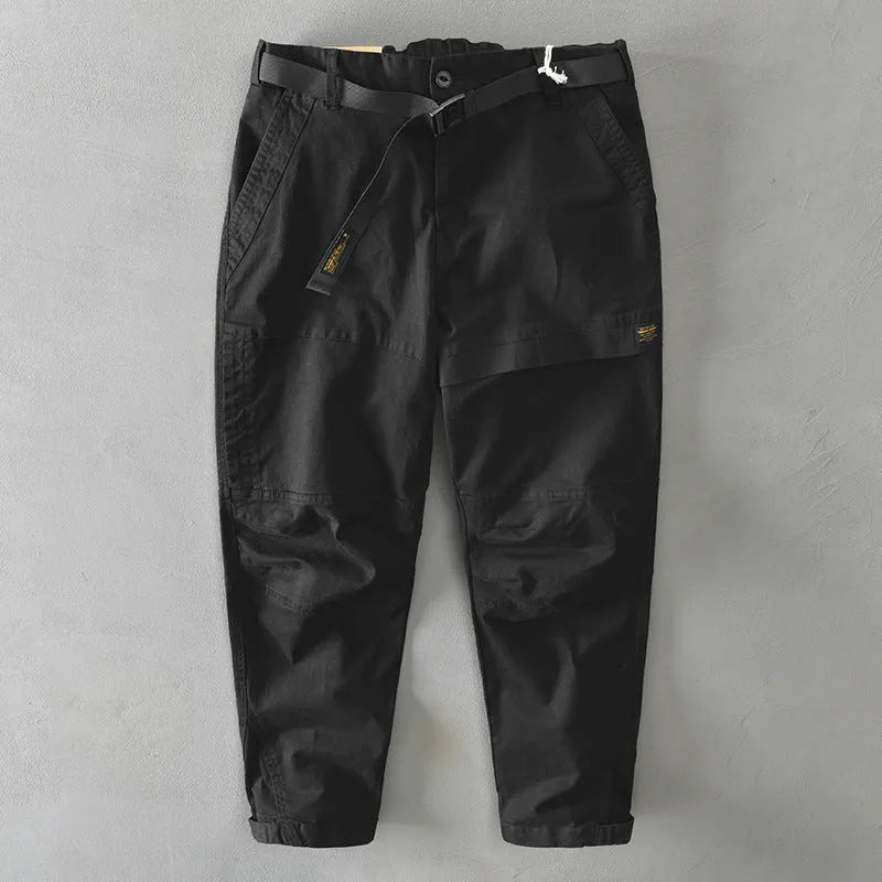 Men's loose-fit cotton overalls in army green colour, showing casual Japanese style and mid-waist design.