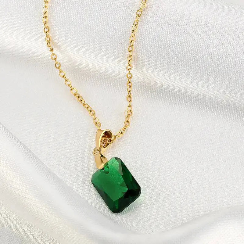 Rectangular copper pendant necklace with geometric quadrilateral design and green finish on O-ring chain.