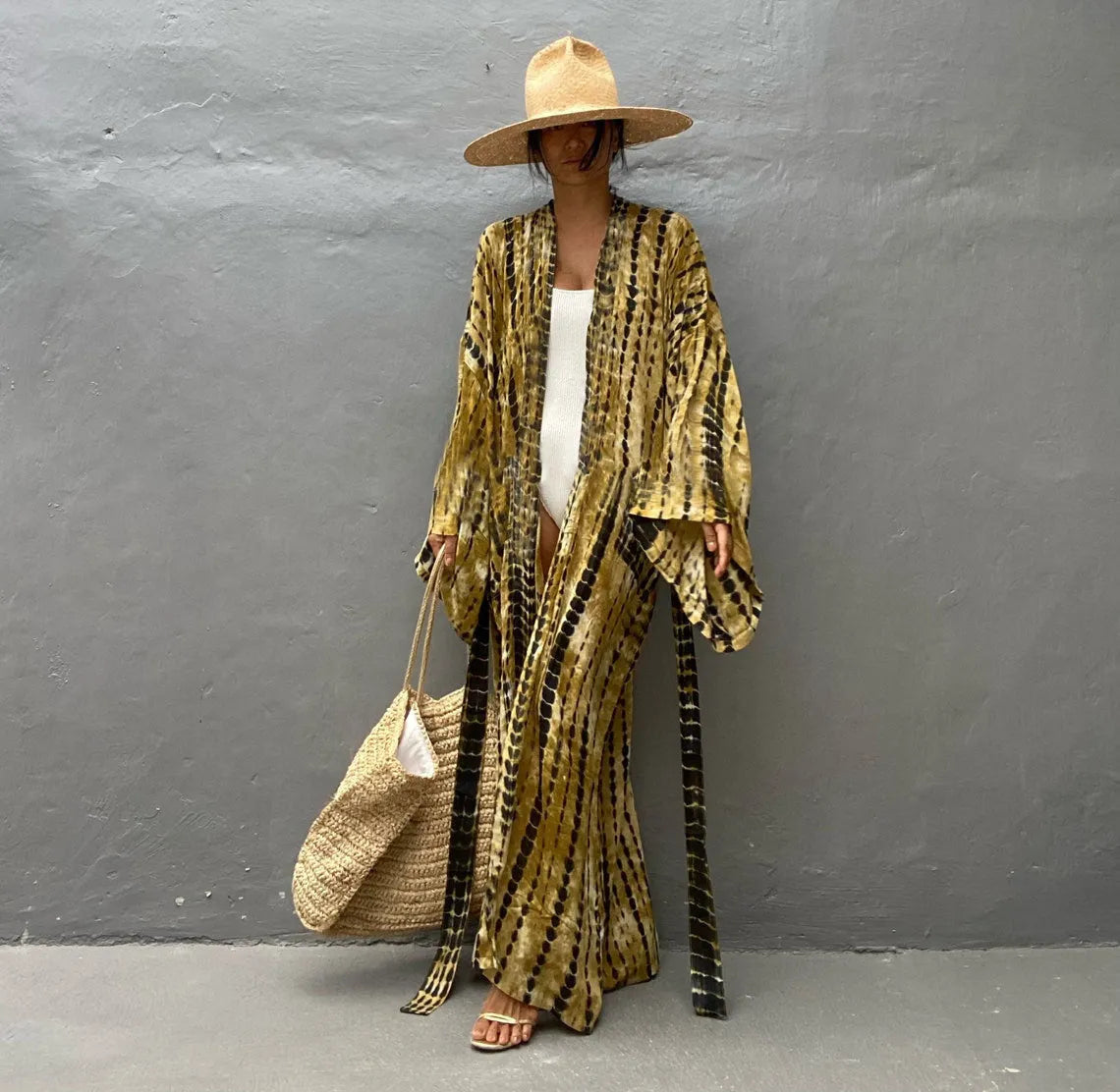 Loose-fitting cotton beach cover-up blouse in a printed pattern, shown in a rust red colour.