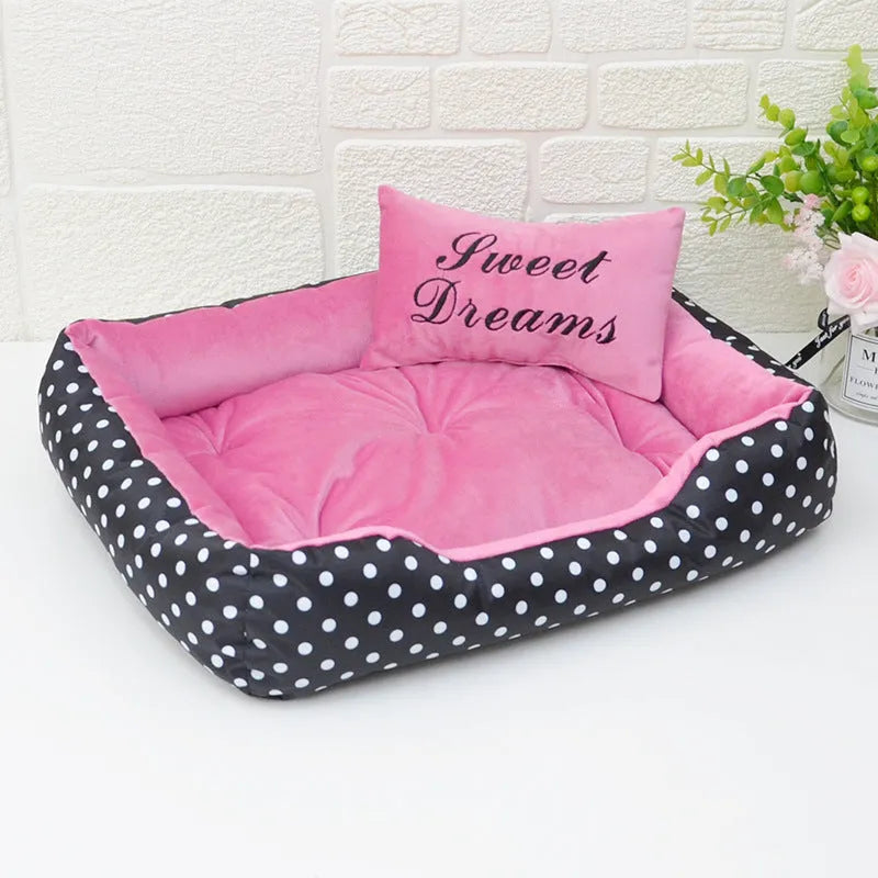 Polka dot print dog bed with a matching square pillow in grey, blue, pink, or red.