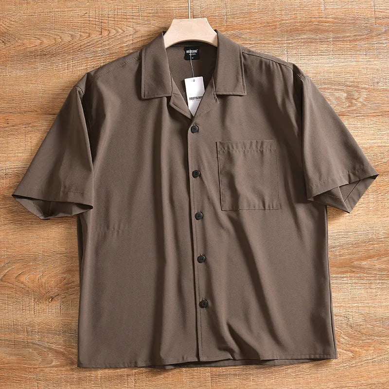 Men's loose fit short sleeve shirt in polyester cotton fabric, shown in army green colour