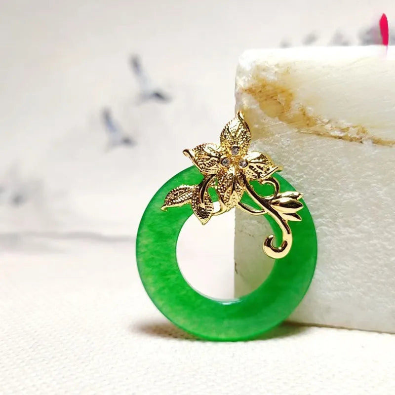 Quartz rock jade pendant necklace with emerald inlay on gold chain