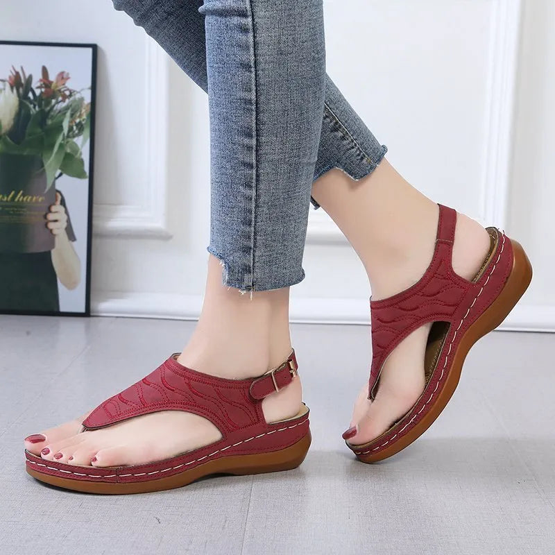 Women's casual wedge heel flip flop sandals with an adjustable back strap in solid colours.
