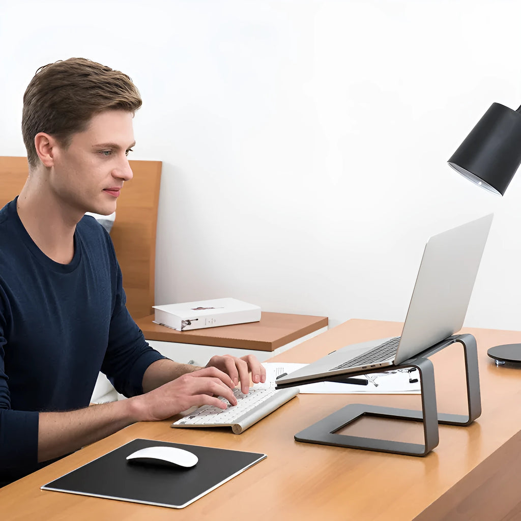Aluminium laptop stand in black or silver with ventilation gap and foldable design