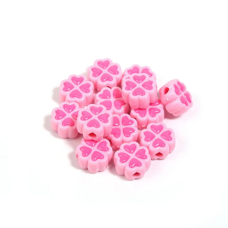 Acrylic four-leaf clover beads with frosted finish in mixed cartoon colours