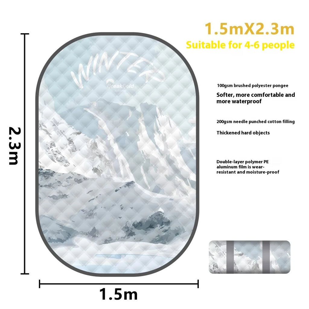 Large rectangular waterproof picnic mat with a brushed fabric texture, shown folded and in use outdoors.