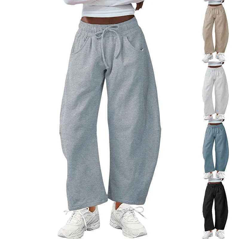 Loose cropped sweatpants with drawstring waist and side pockets in European street style