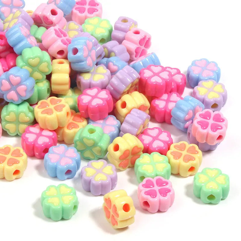 Acrylic four-leaf clover beads with frosted finish in mixed cartoon colours
