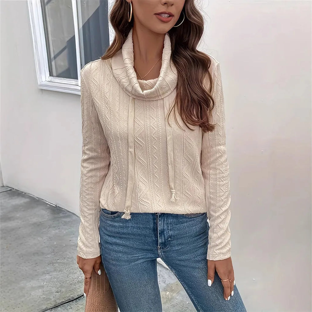 Apricot coloured hooded pullover sweater with drawstring and long sleeves laid flat