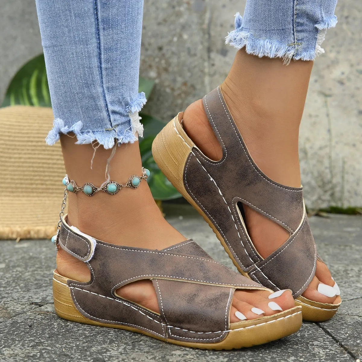 Roman-style women's platform sandals with an open toe and an adjustable Velcro ankle strap.