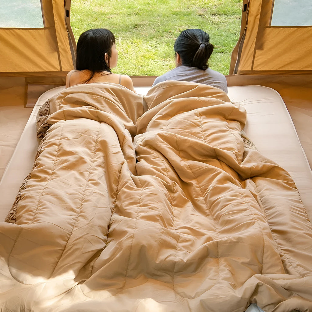 Four Seasons portable camping sleeping bag with storage bag in choice of three colours.