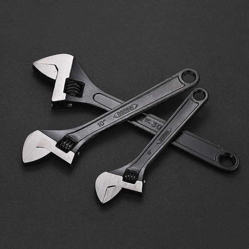 High-carbon steel open-end adjustable wrench with black finish on ergonomic handle.