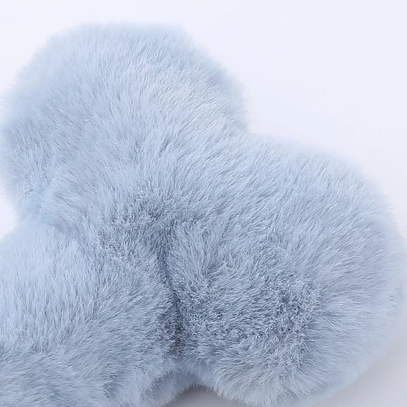 Soft blue plush love bone dog toy with a squeaker for interactive play.