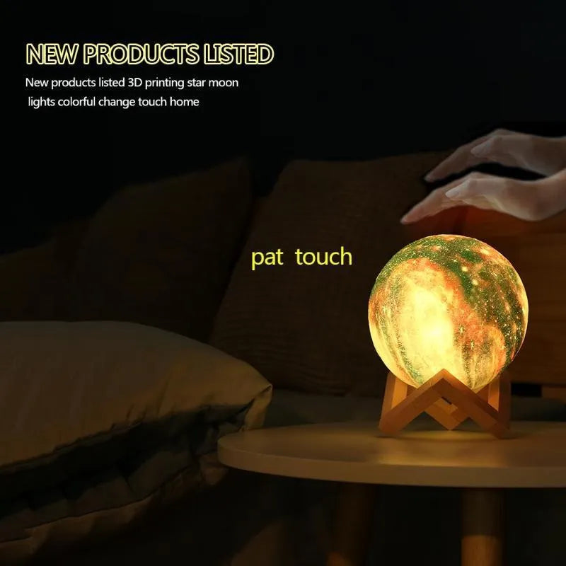 3D printed white lunar night light with colour-changing LED sphere on a stand, showing remote control.