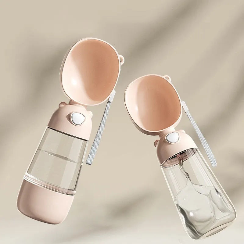 Portable dog water bottle and food container in yellow, pink, and brown colour options.