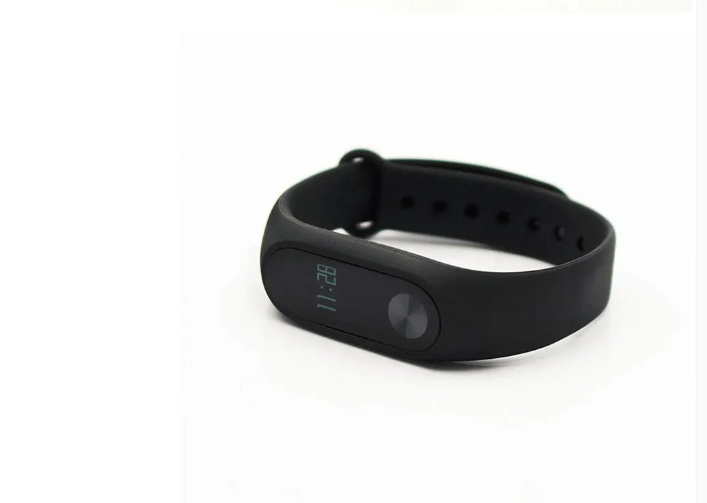 Xiaomi Mi Band 2 black fitness tracker with OLED screen on a grey wrist strap.
