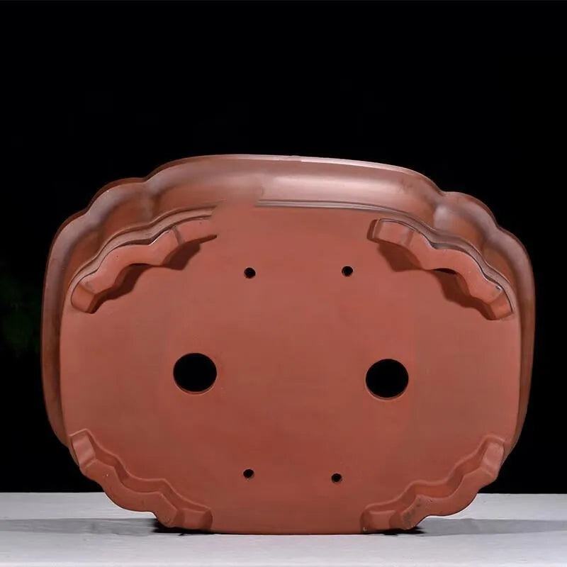 Large antique-finish Chinese purple clay flowerpot shaped like a tree stump with decorative carvings.