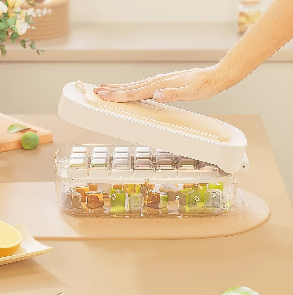 Yellow lever-operated ice cube tray grid with high capacity design and stored ice shovel.