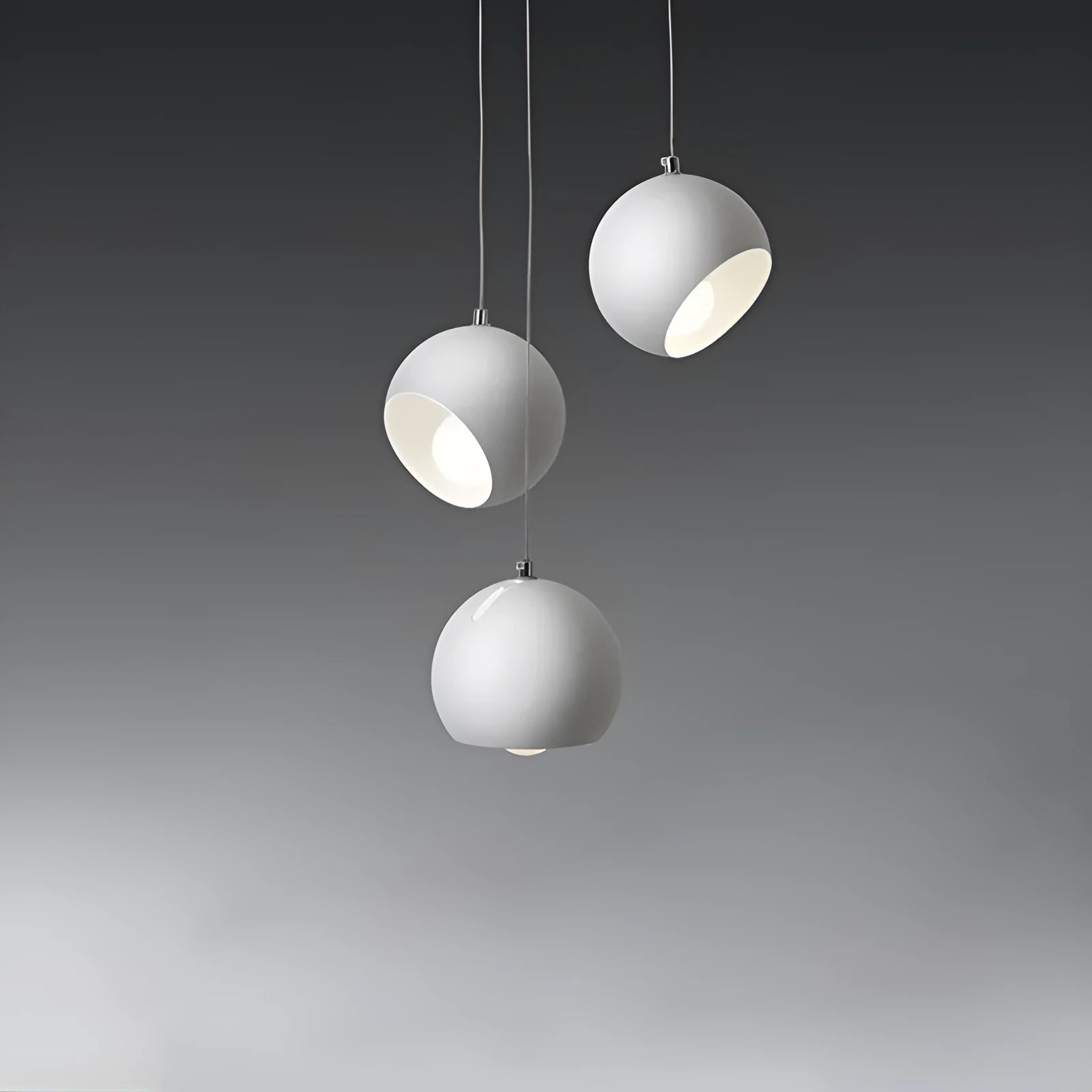 Modern Nordic-style ball chandelier table lamp in Moon White finish on a wooden surface.