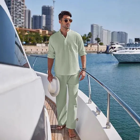 Men's casual cotton suit set in a solid colour, featuring a long-sleeved top and matching trousers.