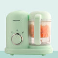 Green baby food processor with steamer and blender functions and a 10-litre capacity.