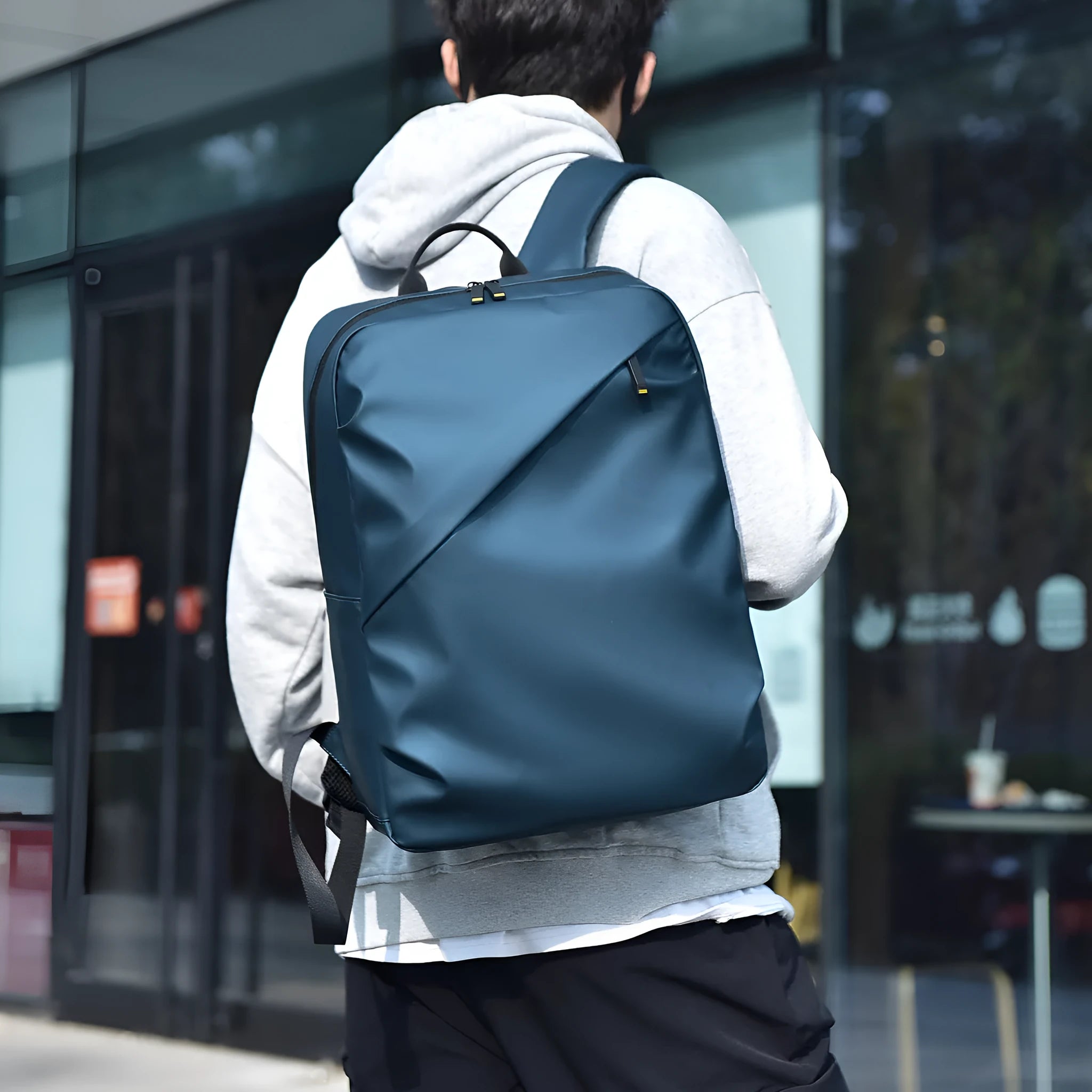 Waterproof black PU leather backpack with sewing thread details and large capacity storage