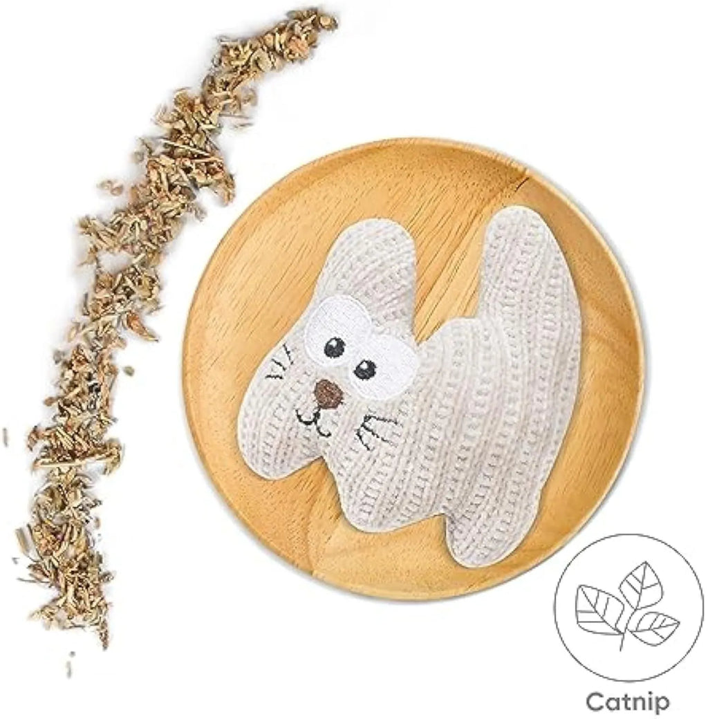 Cyan knitted plush cat toy with bell and catnip filling on a white surface.