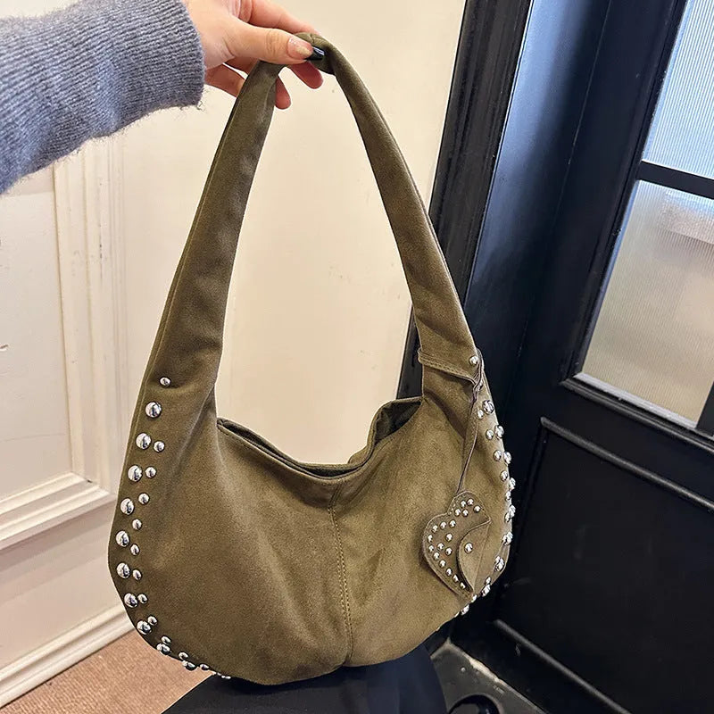 Soft plush women's tote handbag in retro style, carried underarm.