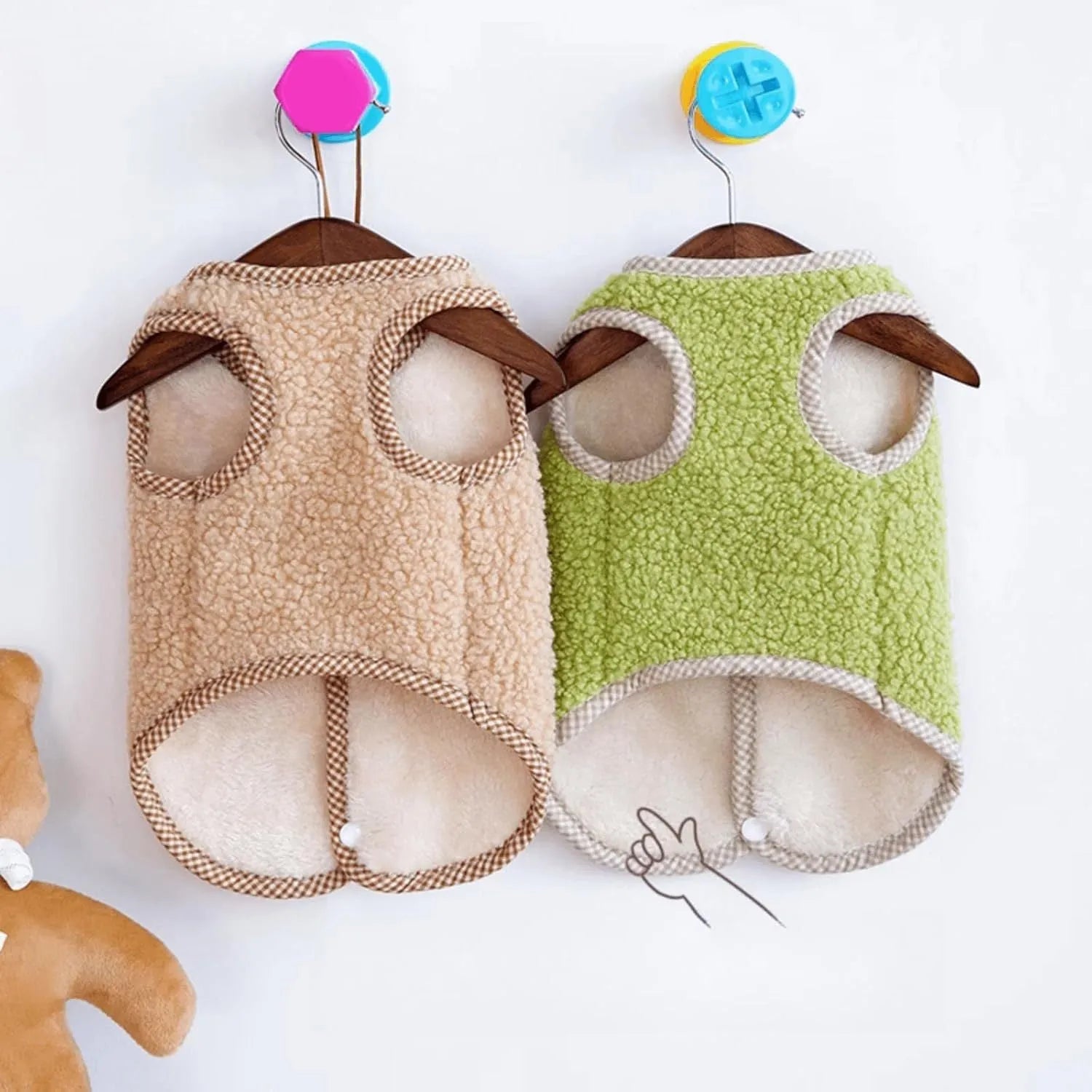Green coral fleece dog sweatshirt vest with a leash ring on a small dog, showing a winter outfit.