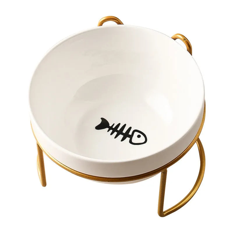 White ceramic pet bowl with cat paw design on a black metal stand with cat ear details.