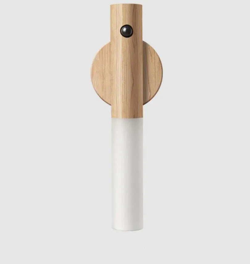 Compact wooden and acrylic motion sensor LED desk lamp on a desk