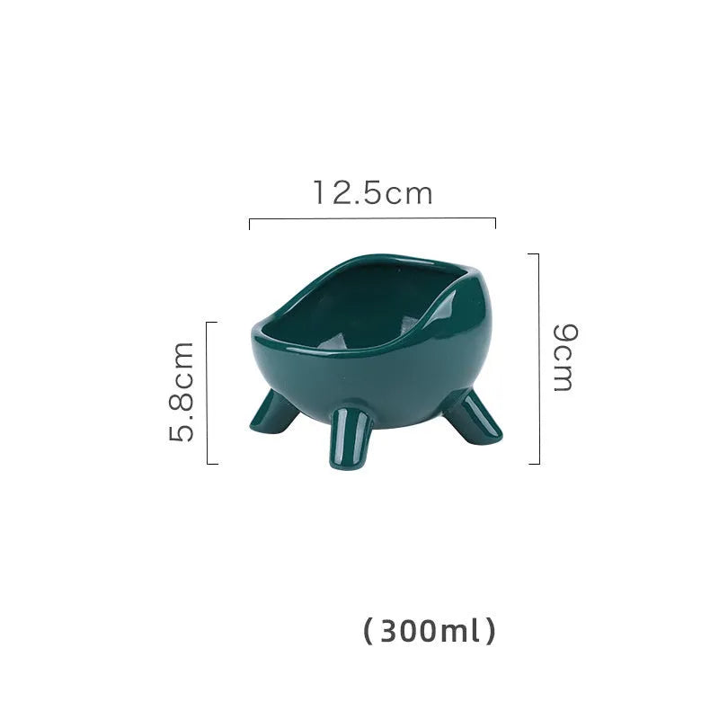 Green ceramic pet food bowl with four-legged stability design for cats and small dogs
