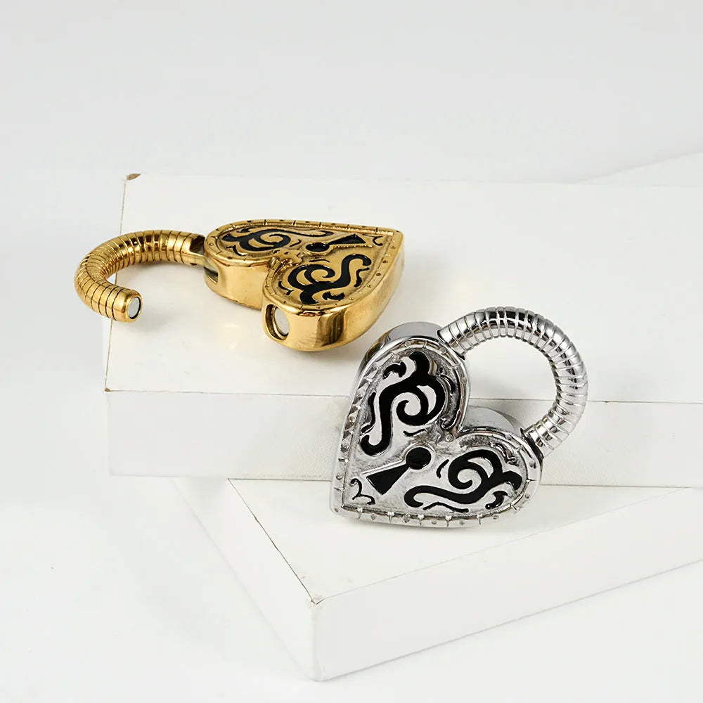 A pair of women's heart-shaped stainless steel earrings in a gold colour finish.