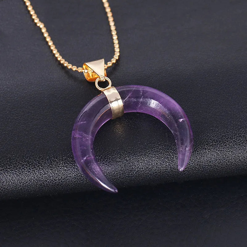 Natural semi-precious stone moon pendant necklace on a 45cm copper chain, shown in pink and purple colour options.