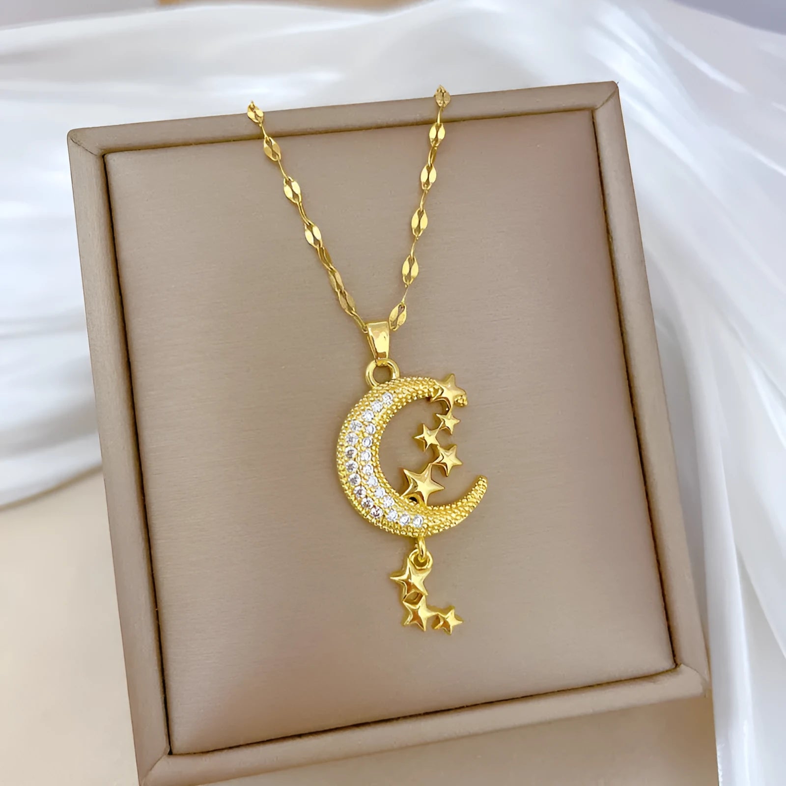 Moon tassel necklace with diamond elements on stainless steel chain and copper pendant