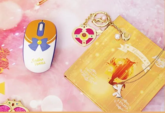 Sailor Moon wireless computer mouse with pink character design showing three buttons and USB receiver