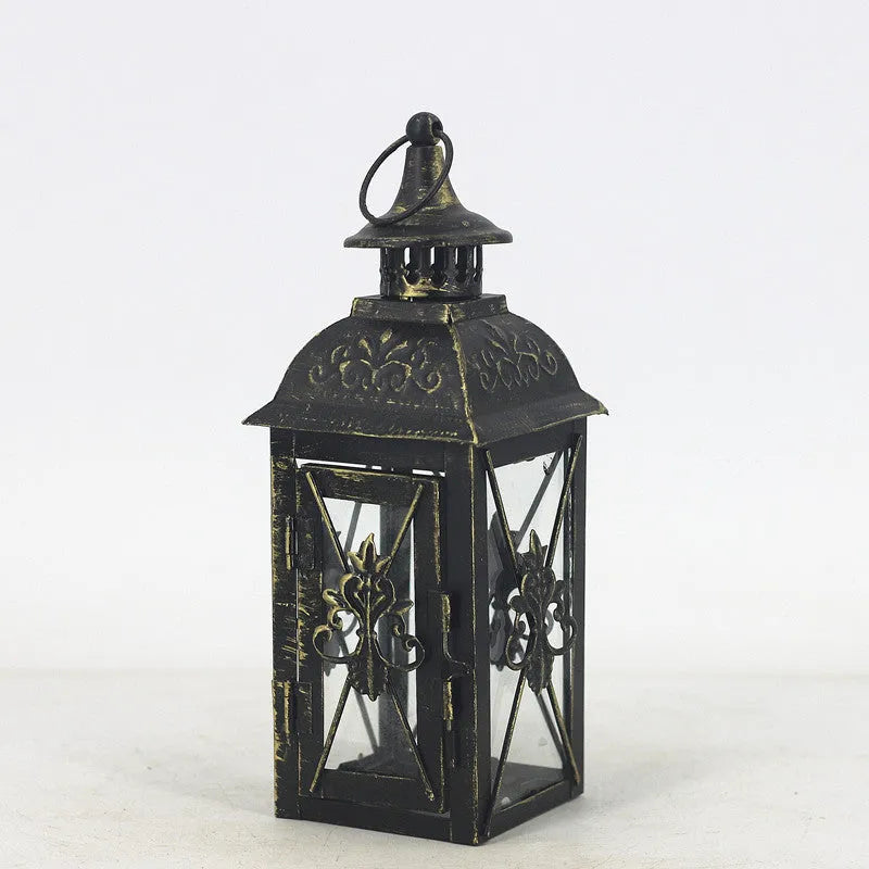 Black and white wrought iron floor-standing storm lantern with tempered glass panels for courtyard use