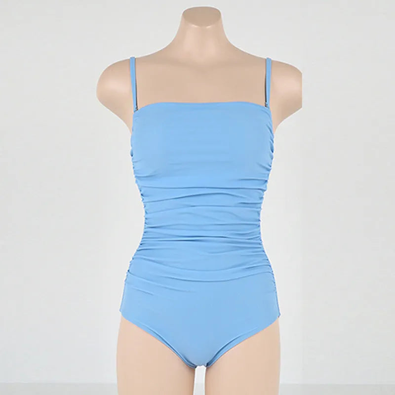 Sling style belly pleated one-piece swimsuit in blue, white, yellow, or black colours