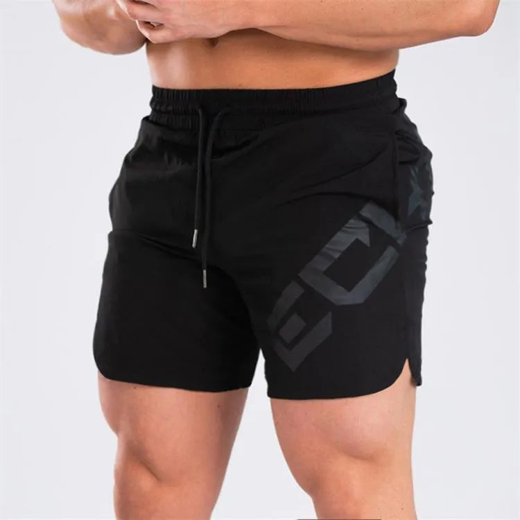 Men's black elastic training shorts with a knee-length cut on a plain background.