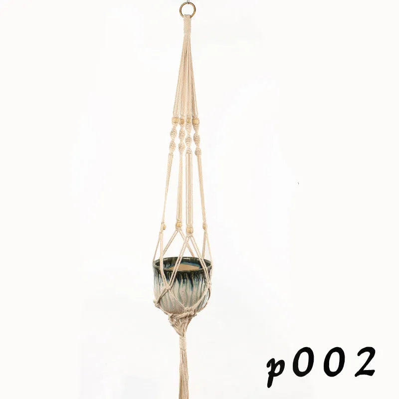 Woven wire basket made of cotton rope shown in a desktop setting.