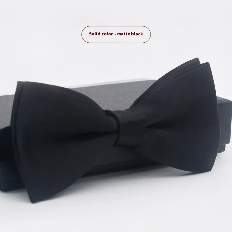 Men's flat head solid colour bow tie in polyester, showing 12cm by 6cm size on a background.