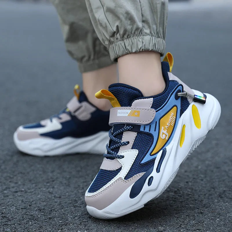 Boys' platform sports running shoes in dark blue with Velcro strap and mesh upper.