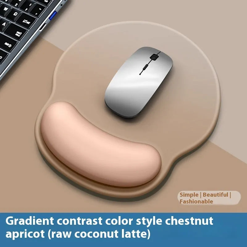Silicone mouse mat with attached gel wrist support in a gradient blue colour on a desk.