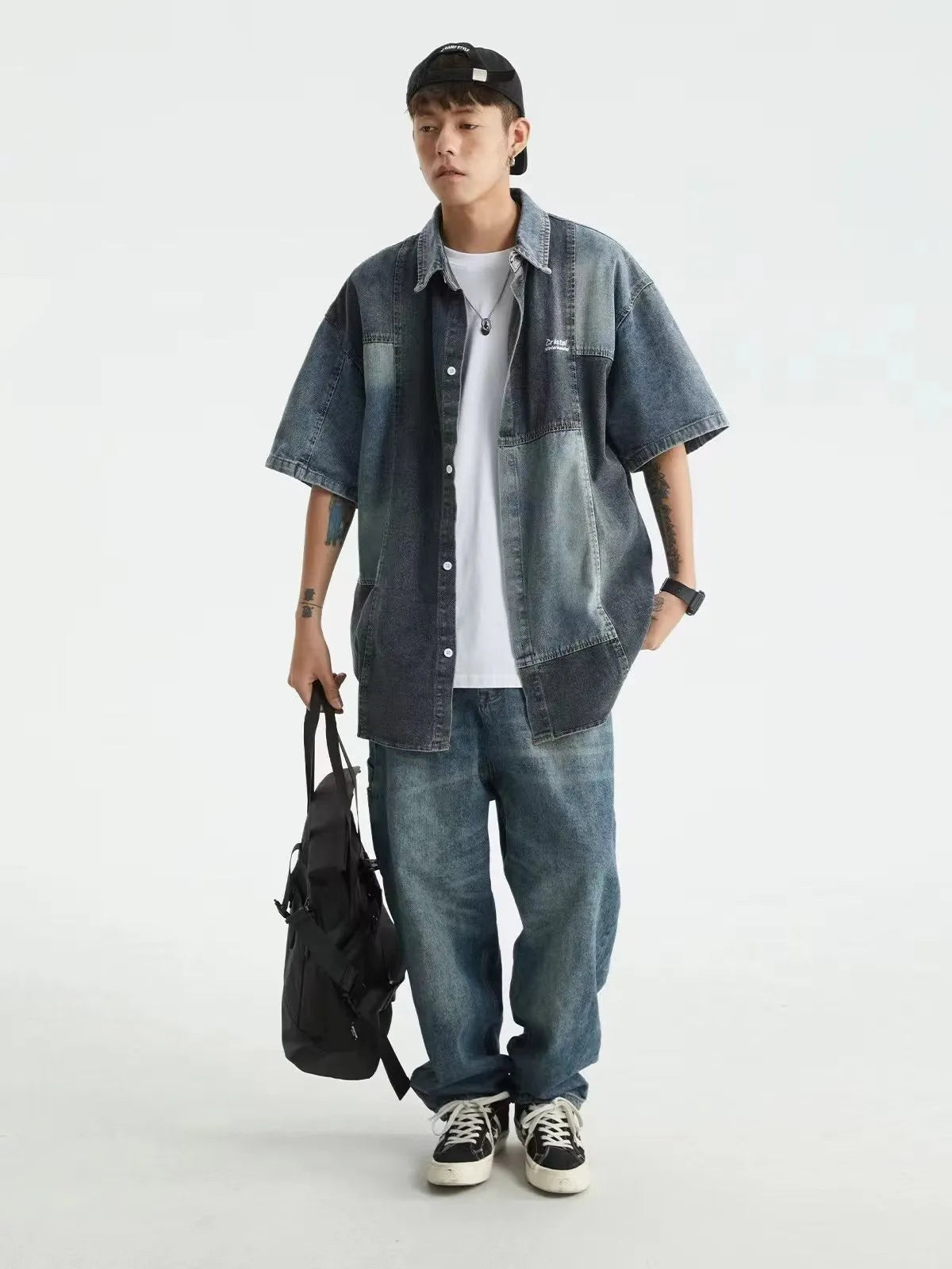 Blue Japanese-style loose-fit denim shirt for men with washed stitching detail.