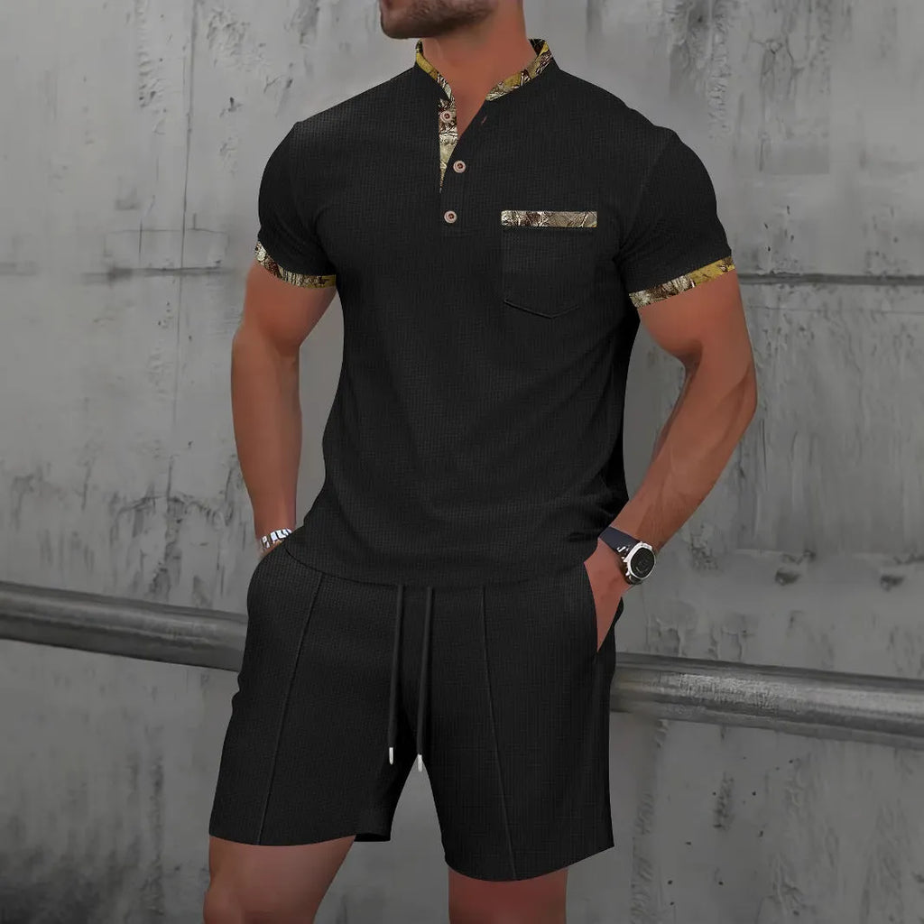 Man wearing a grey waffle knit zip-up polo collar tracksuit with matching shorts for summer leisure.