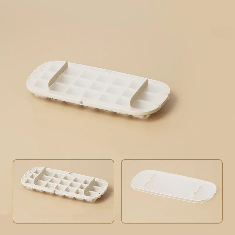 Yellow lever-operated ice cube tray grid with high capacity design and stored ice shovel.